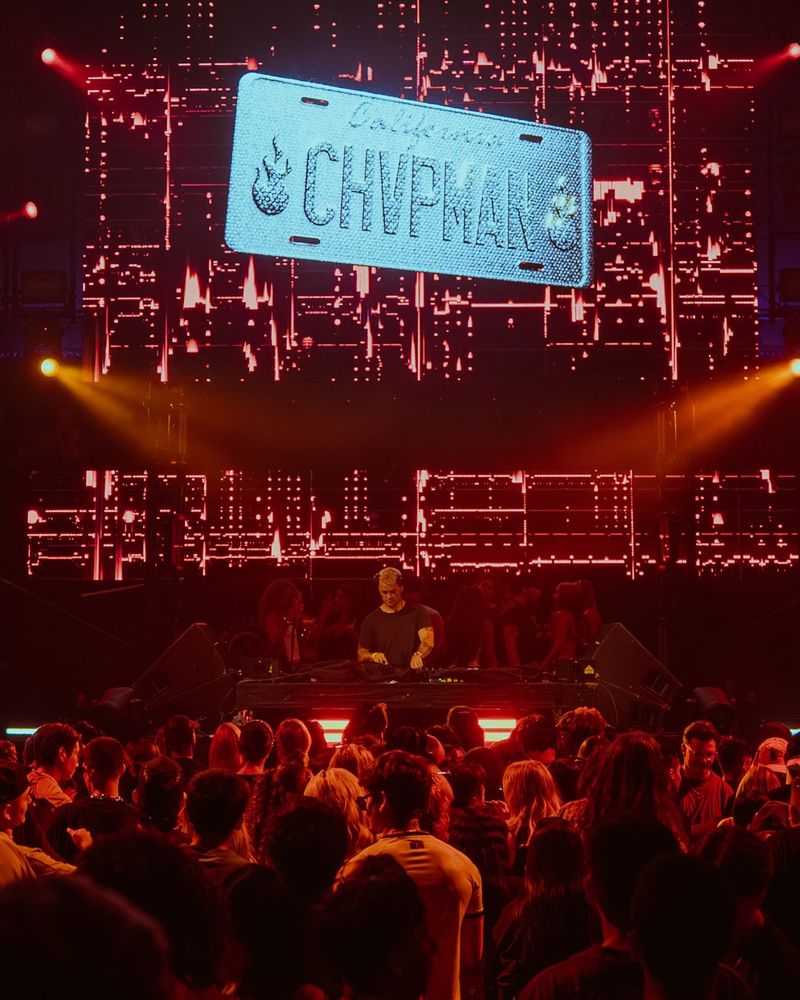 CHVPMAN on stage under the CHVPMAN plate